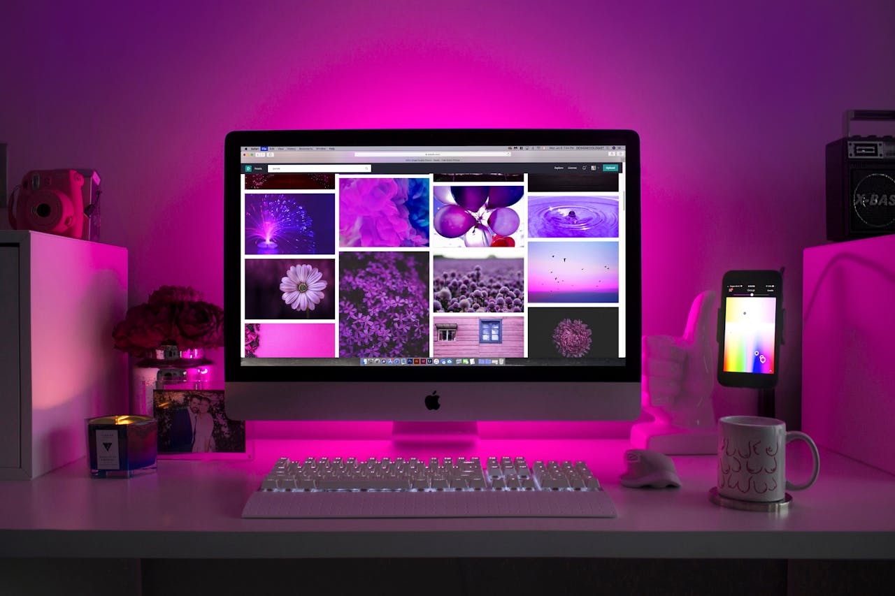 How to Build a Social Media Strategy That Works (2026 Guide) 🧭 Modern desk setup with neon lighting and a desktop computer displaying colorful images.